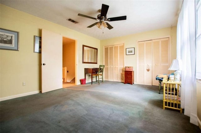 interior space with ceiling fan and carpet