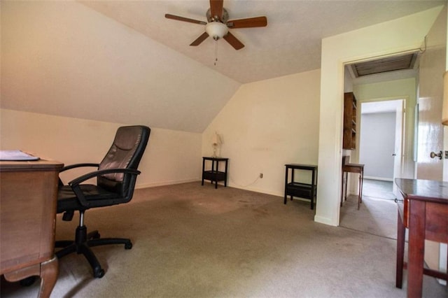 home office with ceiling fan, vaulted ceiling, and light colored carpet