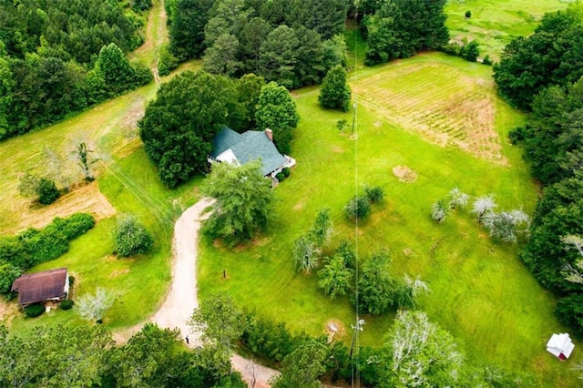 birds eye view of property with a rural view