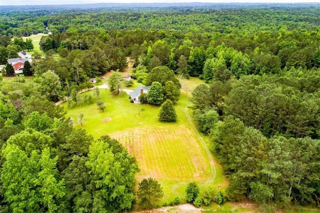 drone / aerial view with a view of trees