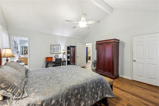 bedroom with beam ceiling, ensuite bath, ceiling fan, high vaulted ceiling, and hardwood / wood-style floors