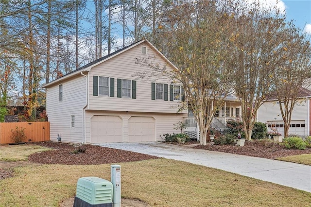 view of front of property featuring a garage and a front yard