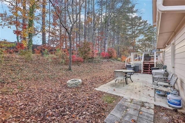 view of yard with a patio and a wooden deck