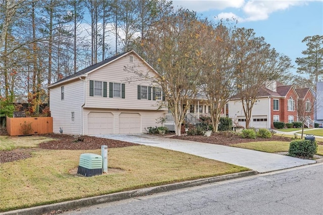 view of front facade with a front yard and a garage