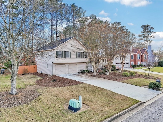 view of front of property with a front lawn and a garage