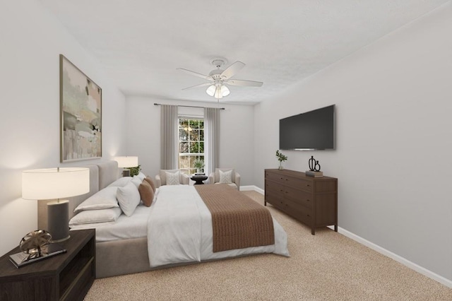 bedroom featuring ceiling fan, light carpet, and baseboards