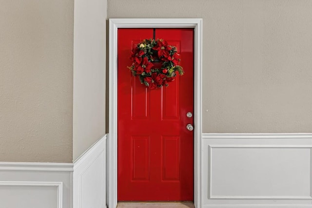 entrance to property featuring stucco siding