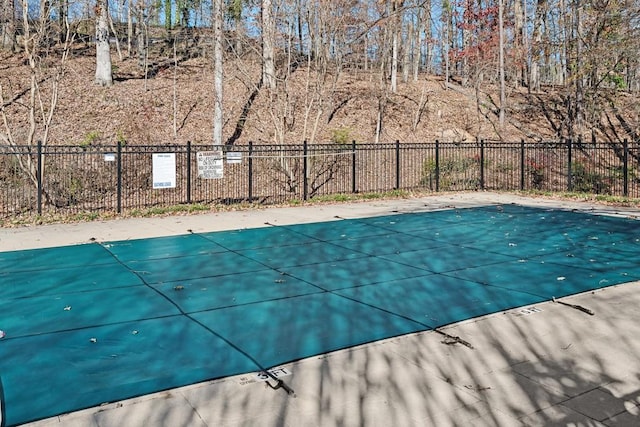 community pool featuring fence