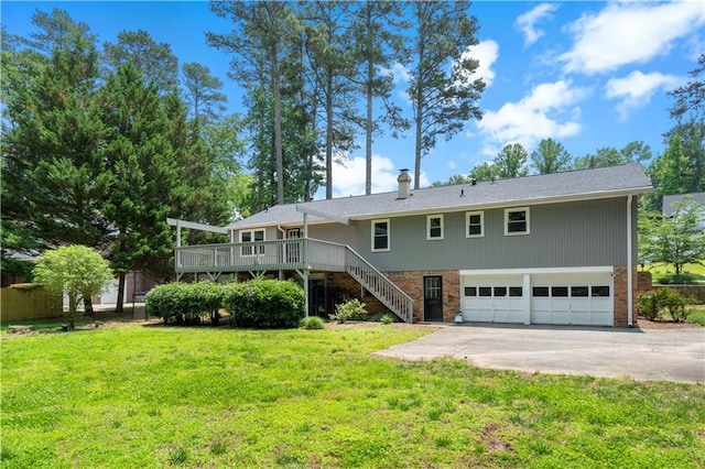 3131 Garden Lane Dr, Marietta, GA 30062 - back of house with a garage, driveway, stairs, a yard, and a deck