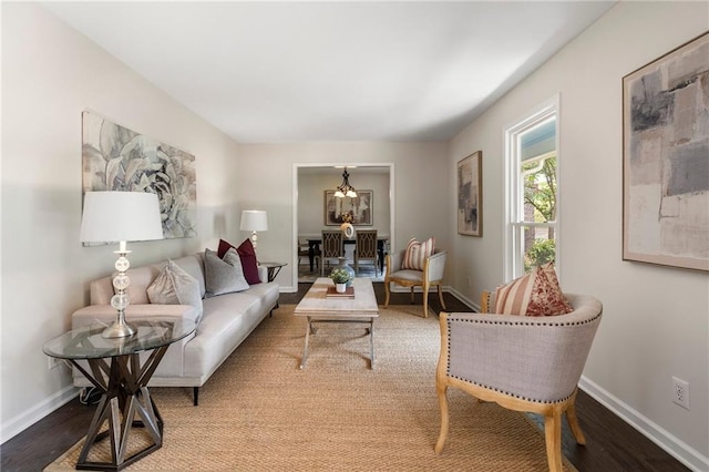 3131 Garden Lane Dr, Marietta, GA 30062 - living room featuring a chandelier, wood finished floors, and baseboards