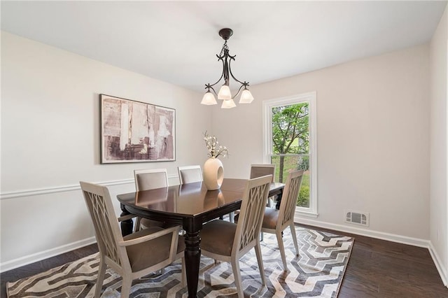 3131 Garden Lane Dr, Marietta, GA 30062 - dining area with baseboards, wood finished floors, and a chandelier