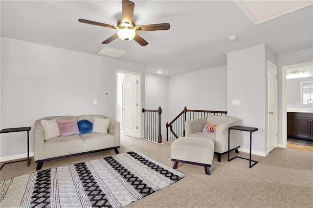 living room with ceiling fan and light colored carpet