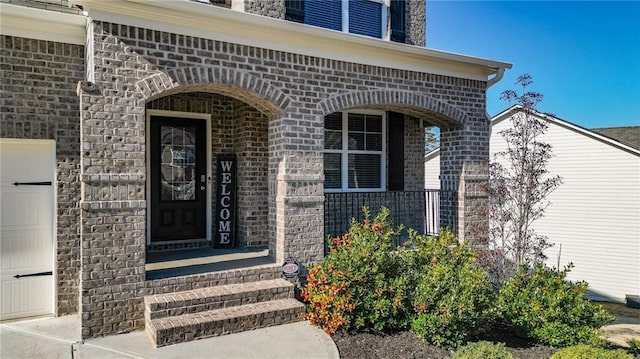 property entrance with a garage