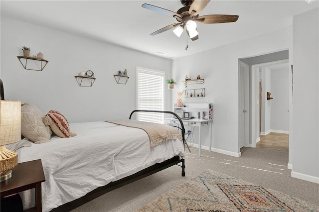 carpeted bedroom featuring ceiling fan