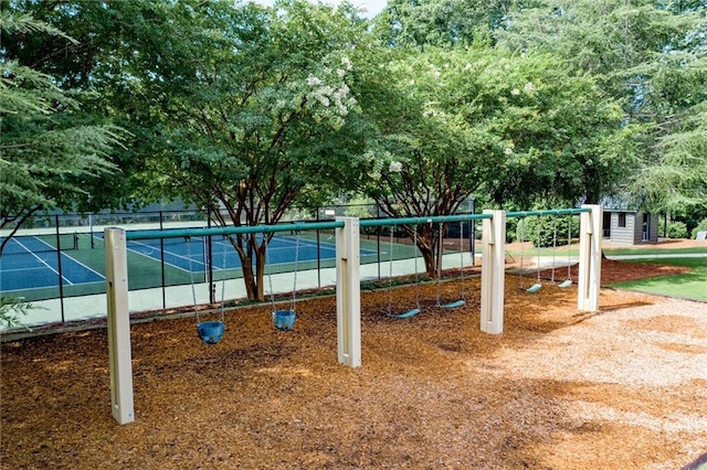 view of jungle gym with tennis court