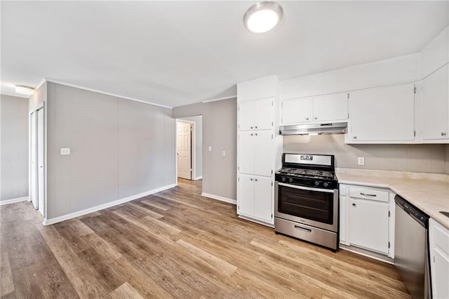 kitchen featuring stainless steel appliances, light countertops, light wood-type flooring, under cabinet range hood, and white cabinetry