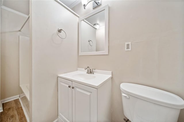 full bathroom featuring vanity,  shower combination, wood finished floors, and toilet