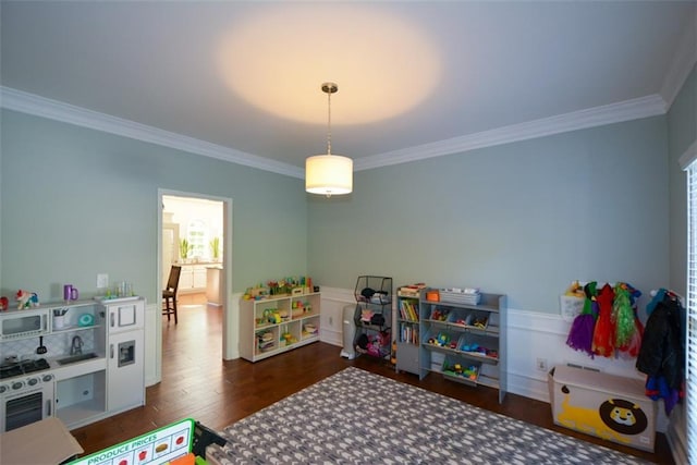 rec room with crown molding and wood finished floors