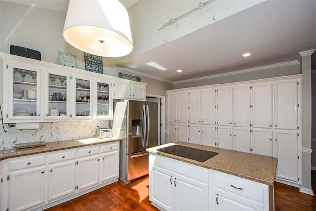 kitchen with stainless steel fridge with ice dispenser, black electric cooktop, white cabinets, crown molding, and recessed lighting