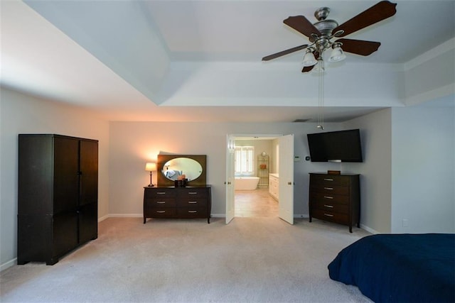 bedroom with light carpet, a raised ceiling, baseboards, and ceiling fan