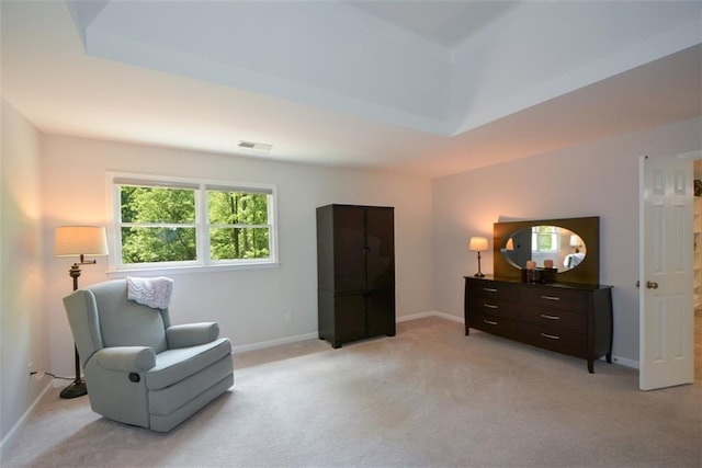 sitting room featuring light carpet and baseboards