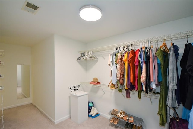 walk in closet featuring carpet floors