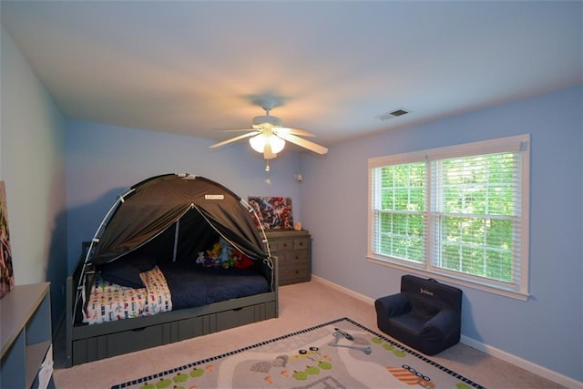 bedroom with carpet floors, baseboards, and ceiling fan