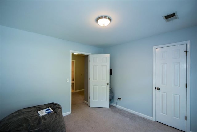 unfurnished bedroom featuring carpet flooring and baseboards