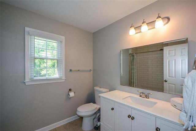 full bath with toilet, a shower with shower curtain, vanity, baseboards, and tile patterned floors