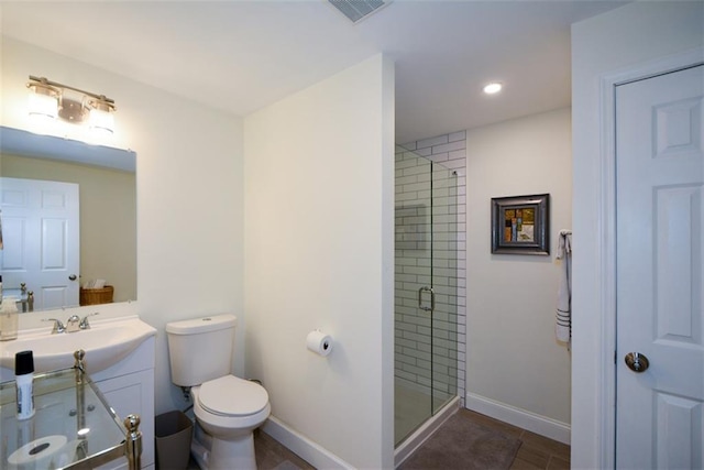 full bath featuring a shower stall, toilet, recessed lighting, vanity, and baseboards