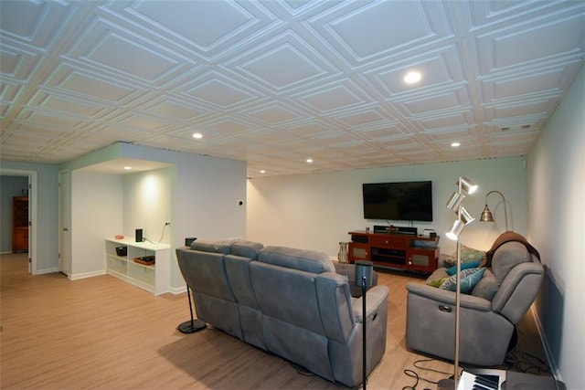 living room with recessed lighting, an ornate ceiling, light wood-style flooring, and baseboards