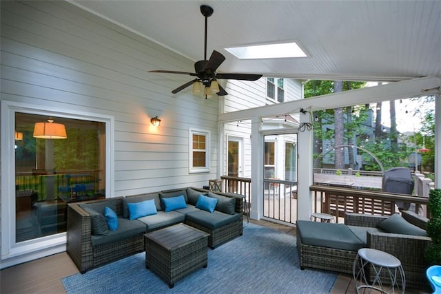 view of patio featuring an outdoor hangout area, ceiling fan, and a sunroom