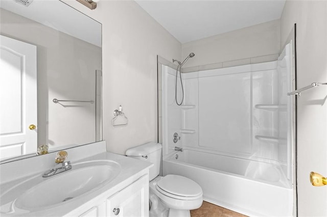 full bath with washtub / shower combination, tile patterned flooring, vanity, and toilet