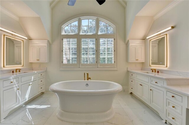 4505 Whitestone Way, Suwanee, GA 30024 - bathroom featuring a sink, a freestanding tub, marble finish floor, and baseboards