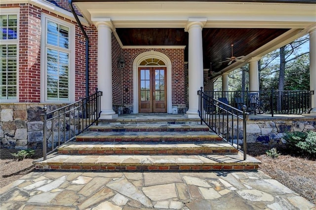 4505 Whitestone Way, Suwanee, GA 30024 - entrance to property featuring brick siding, french doors, and covered porch