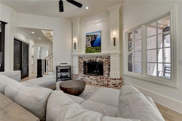 4505 Whitestone Way, Suwanee, GA 30024 - living room with baseboards, light wood-style flooring, a ceiling fan, crown molding, and stairs