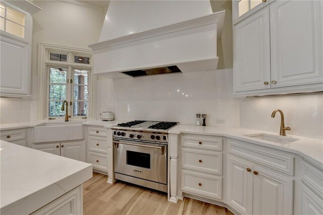 4505 Whitestone Way, Suwanee, GA 30024 - kitchen with premium range, custom range hood, a sink, and backsplash