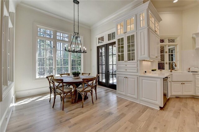4505 Whitestone Way, Suwanee, GA 30024 - dining room with light wood-style floors, ornamental molding, and french doors