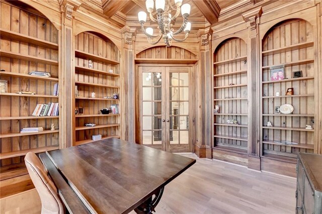 4505 Whitestone Way, Suwanee, GA 30024 - interior space with built in features, an inviting chandelier, wooden walls, french doors, and coffered ceiling