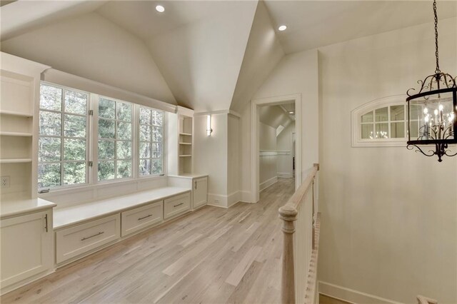 4505 Whitestone Way, Suwanee, GA 30024 - mudroom with a chandelier, light wood finished floors, baseboards, and lofted ceiling