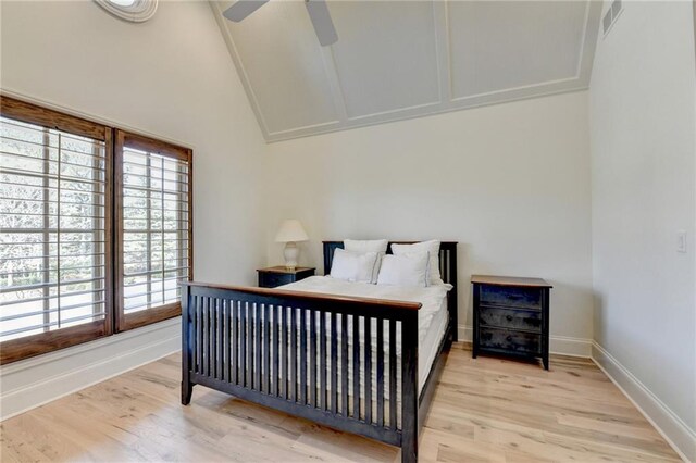 4505 Whitestone Way, Suwanee, GA 30024 - bedroom with visible vents, baseboards, light wood finished floors, and lofted ceiling