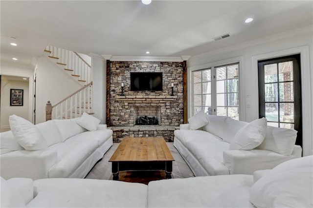 4505 Whitestone Way, Suwanee, GA 30024 - living room with ornamental molding, a stone fireplace, recessed lighting, visible vents, and stairs