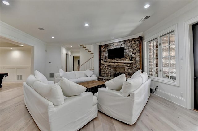 4505 Whitestone Way, Suwanee, GA 30024 - living area with ornamental molding, light wood finished floors, visible vents, and stairs
