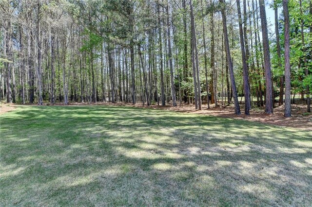 4505 Whitestone Way, Suwanee, GA 30024 - view of yard featuring a forest view
