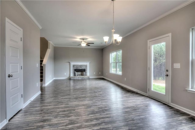 unfurnished living room featuring dark wood-style floors, a fireplace, ornamental molding, baseboards, and stairs