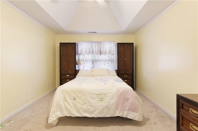 bedroom with visible vents, baseboards, crown molding, a raised ceiling, and light colored carpet