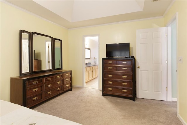 bedroom featuring a sink, ornamental molding, connected bathroom, and light carpet