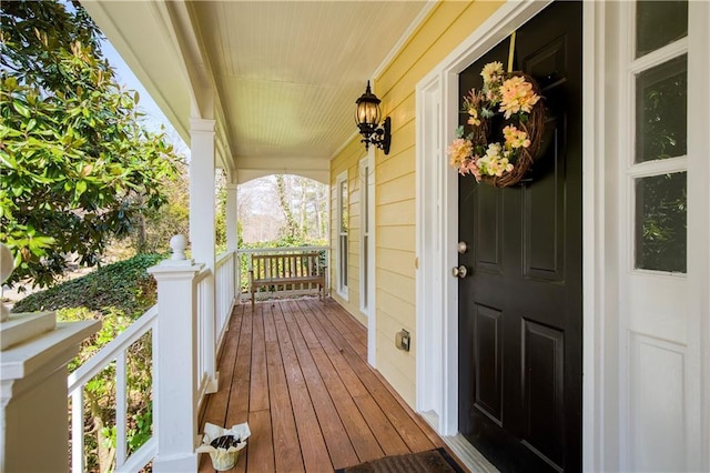 view of exterior entry with covered porch