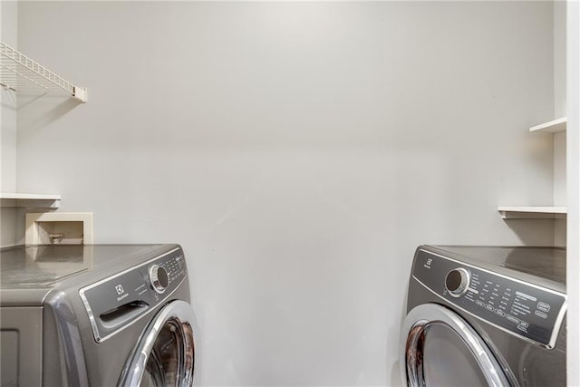 laundry room featuring laundry area and washer and clothes dryer