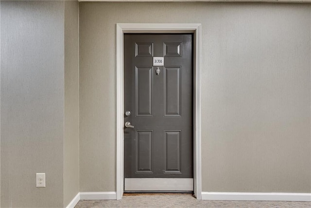 property entrance featuring stucco siding